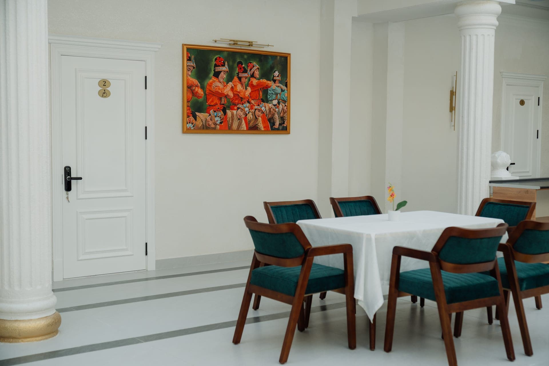 Dining room at Hotel Kampoeng Indonesia with set tables and Indonesian art, Samarkand