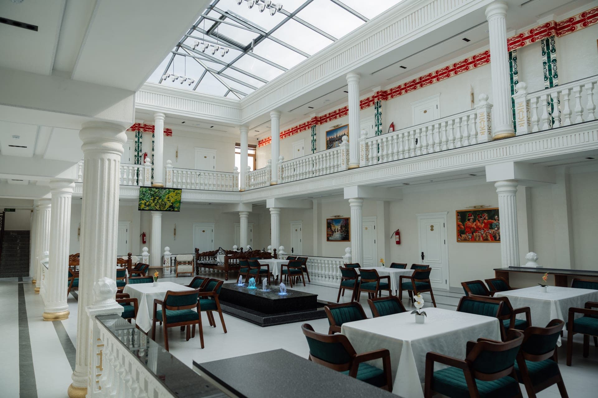 Kampoeng Indonesia restaurant atrium with fountain and dining tables, Samarkand