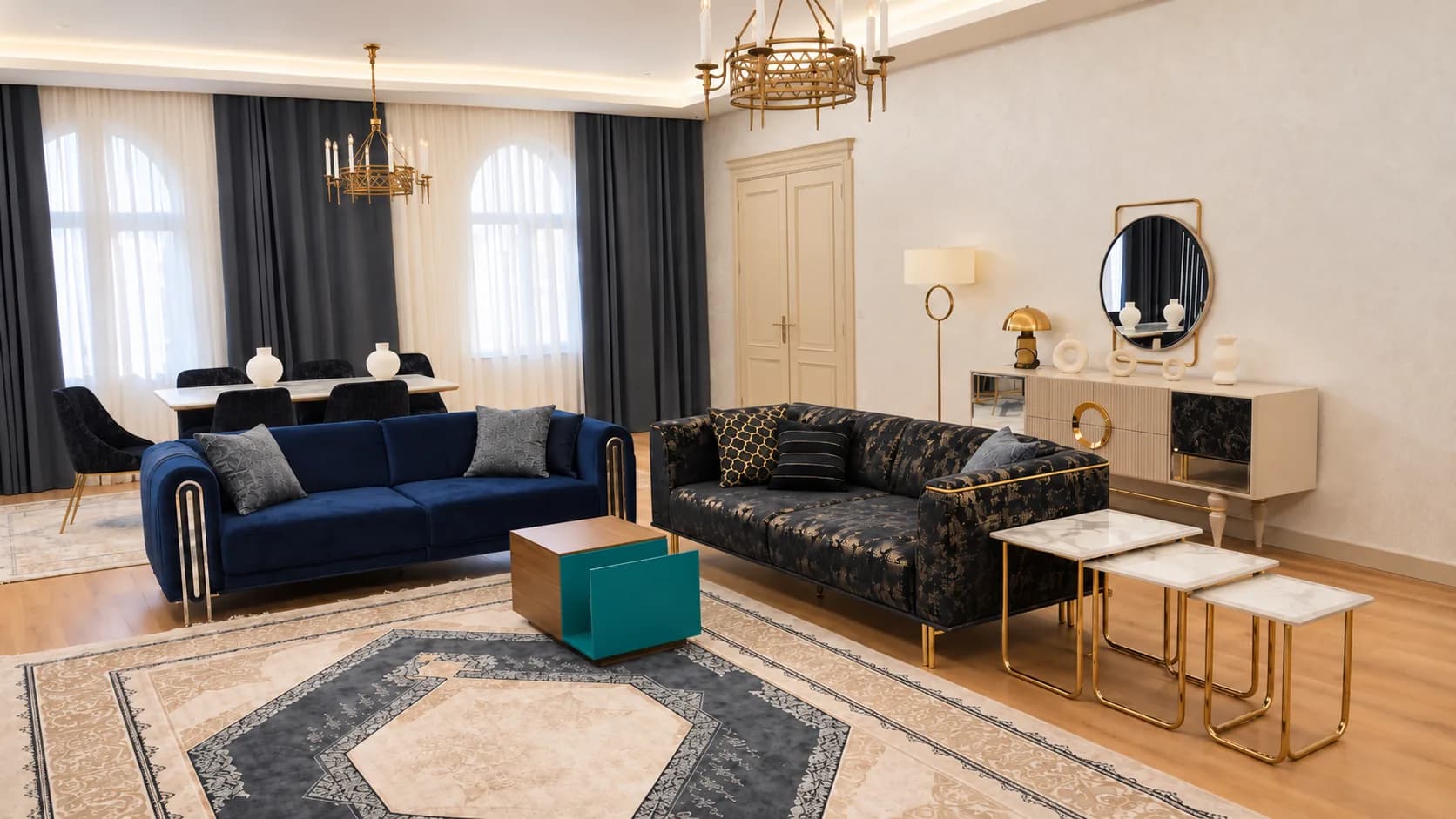 Guest suite lounge with blue sofas, chandeliers, and a patterned rug.